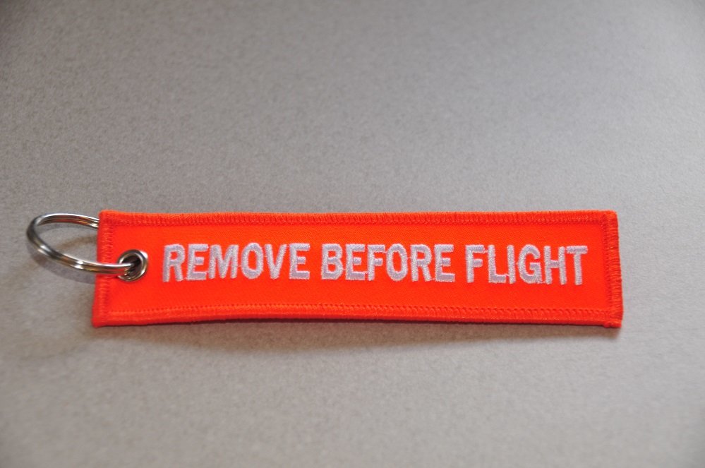 Remove before flight sleutelhanger (oranje)
