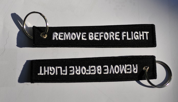 Remove before flight keychain (black color), key ring, luggage tag