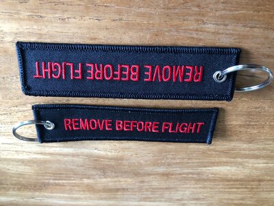 REMOVE BEFORE FLIGHT embroidered keyring keychain  color black & red letters