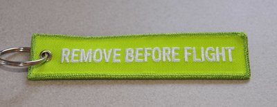 REMOVE BEFORE FLIGHT keychain keyring (light green + white letters)