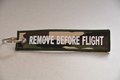 REMOVE BEFORE FLIGHT keychain keyring (camo + white letters)