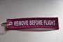 REMOVE BEFORE FLIGHT keychain keyring (pink + white letters)_