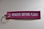 REMOVE BEFORE FLIGHT keychain keyring (pink + white letters)_