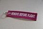 REMOVE BEFORE FLIGHT keychain keyring (pink + white letters)_